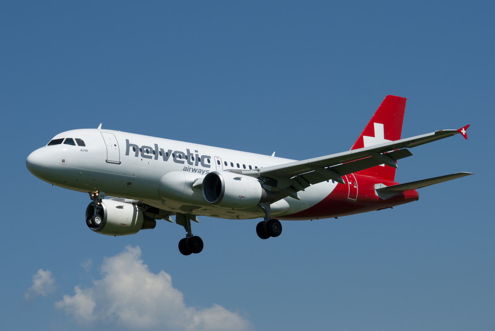 Helvetic_Airways_A319_HBJVK_short_final_LSZB_RWY_32